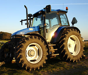 English: A modern 4-wheel drive farm tractor. ...