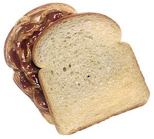 a peanut butter and jelly sandwich, top slice ...