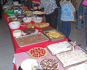 An assortment of food dishes at a church potluck.