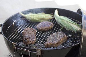 Beef and Corn on a Charcoal BBQ grill