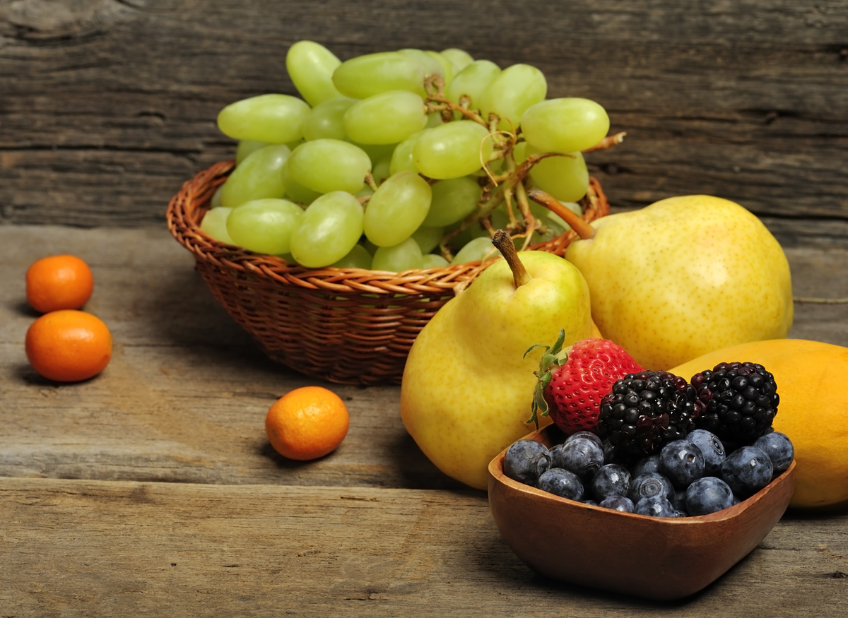 Fresh Fruits And Berries On Wooden Background